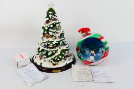 Christmas decorations to include a Thomas Kinkade Village Christmas illuminated tree,