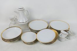 A collection of dinner and tea wares, white glaze with gilt, approximately 40 pieces.