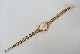 A 9ct yellow gold cased wrist watch on 9ct gold bracelet, approximately 9.