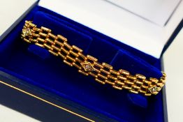 A 9ct gold gate link bracelet with four illusion set diamonds, 9ct padlock clasp and safety chain,