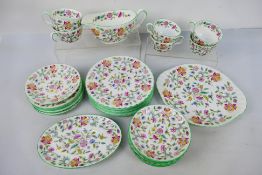 A collection of Minton table wares decorated in the Haddon Hall pattern, 30 pieces.