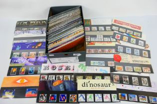 Philately - A collection of Royal mail mint stamp presentation packs, in excess of £150 face value.