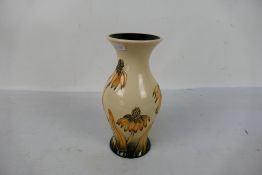 Moorcroft Pottery - A Moorcroft Pottery vase decorated in the Coneflower pattern, dated 2002,