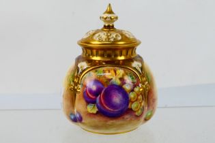 Royal Worcester - A small potpourri vase and cover of squat lobed form,