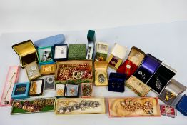 A collection of various boxed costume jewellery and jewellery boxes.