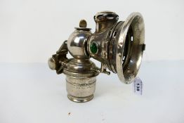 A Joseph Lucas Calcia Toura acetylene or carbide bicycle lamp with green tell tales, 17.5 cm (h).