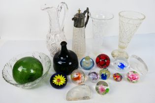 Glassware to include paperweights, antique green glass bottle, white metal mounted decanter,