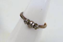 A diamond trilogy ring set with approximately 20 pts, shank stamped PLAT 18ct, size H,