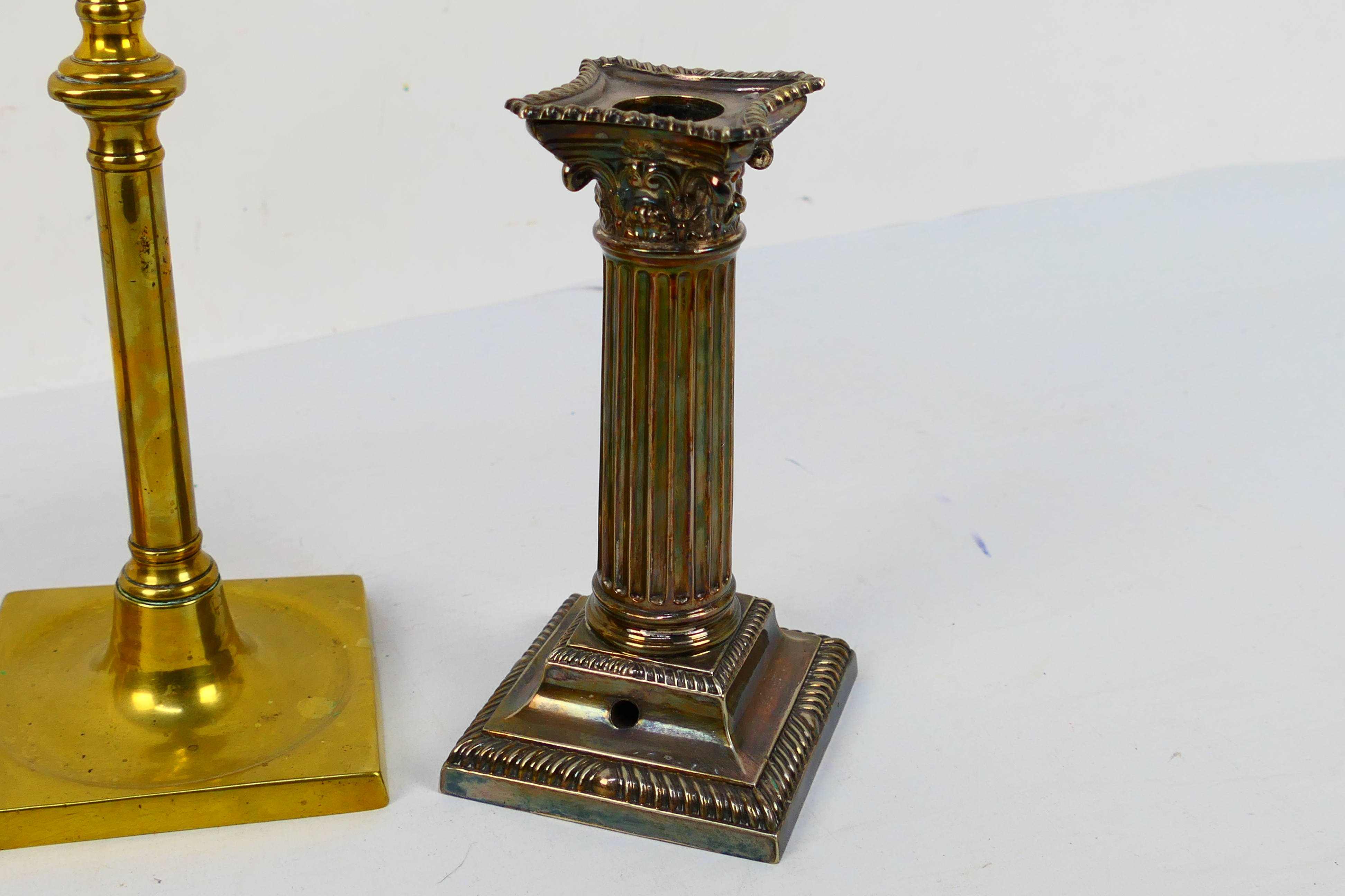 Two pairs of candlesticks comprising a pair of silver plated Corinthian column examples and a brass - Image 2 of 4