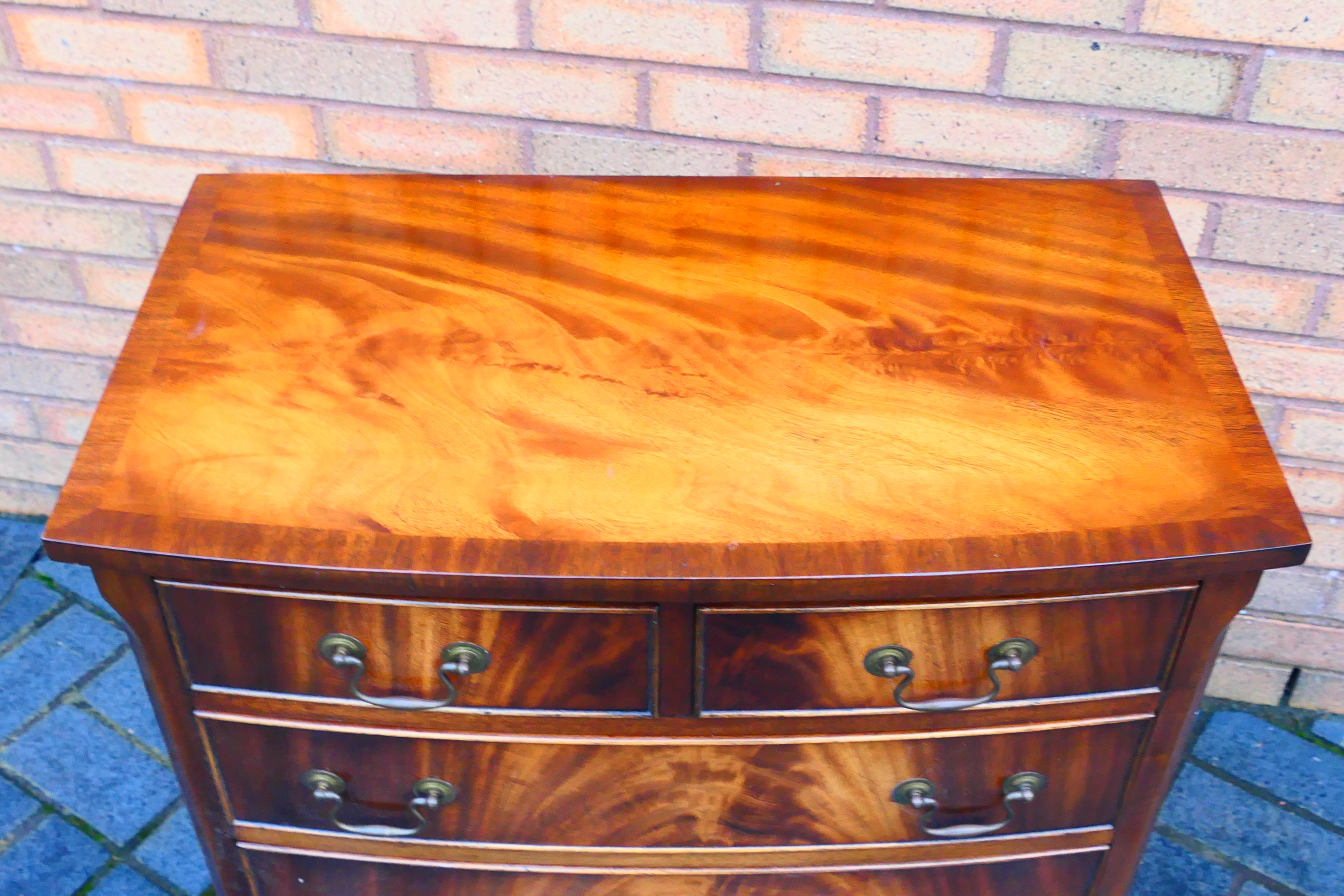 A bow front chest of two over three drawers, raised on outswept supports, - Image 3 of 5