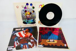 A small quantity of 12" vinyl records to include Queen Innuendo PCSD115,