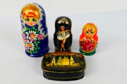 Russian Nesting Dolls - Three sets of five hand painted Matryoshka dolls to include a set decorated