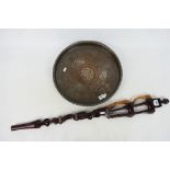 Ethnographica - An African tribal carving, 88 cm (l) and an Islamic copper dish, 40 cm (d). [2].