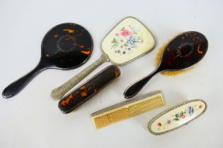 Dressing table items to include silver mounted mirror and brushes, Birmingham assay 1921.