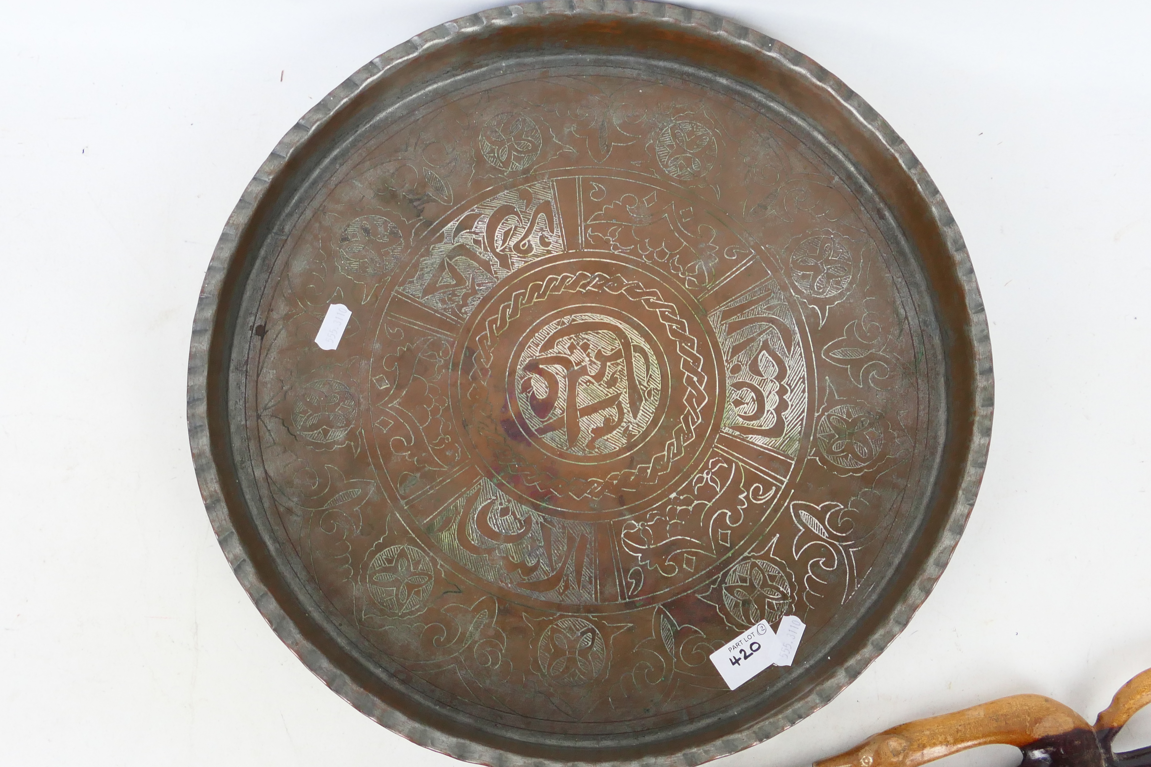 Ethnographica - An African tribal carving, 88 cm (l) and an Islamic copper dish, 40 cm (d). [2]. - Image 2 of 8