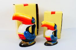 A novelty Guinness money bank in the form of a toucan, 21 cm (h) and a similar water jug,