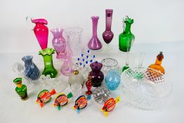Glassware to include bowls, vases, amber glass bottle with silver clad stopper,