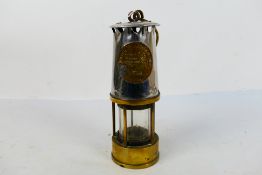 A Protector Lamp & Lighting Co, Eccles Manchester, Type MC40 safety lamp, 24 cm (h).