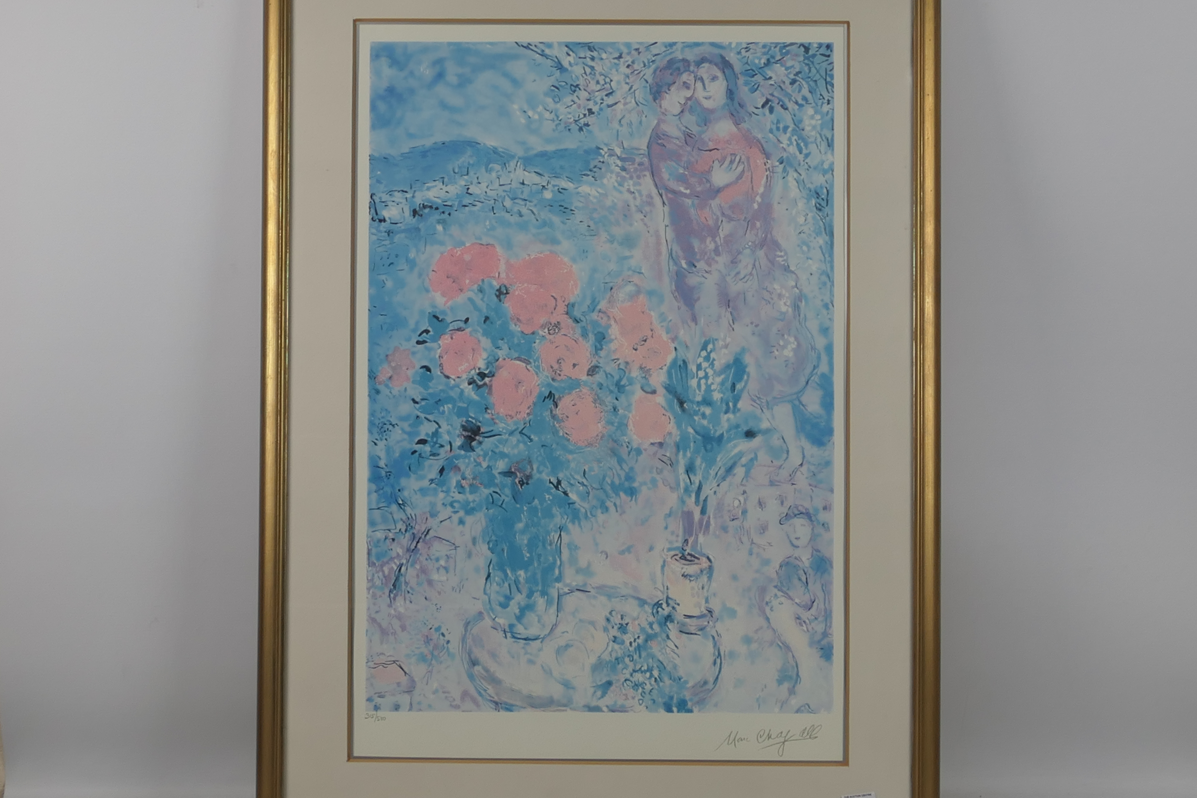 A limited edition print after Marc Chagall entitled Red Bouquet With Lovers, numbered 315/500,