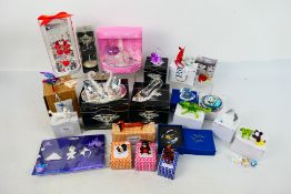 A collection of boxed gift ware items, predominantly glass ornaments.