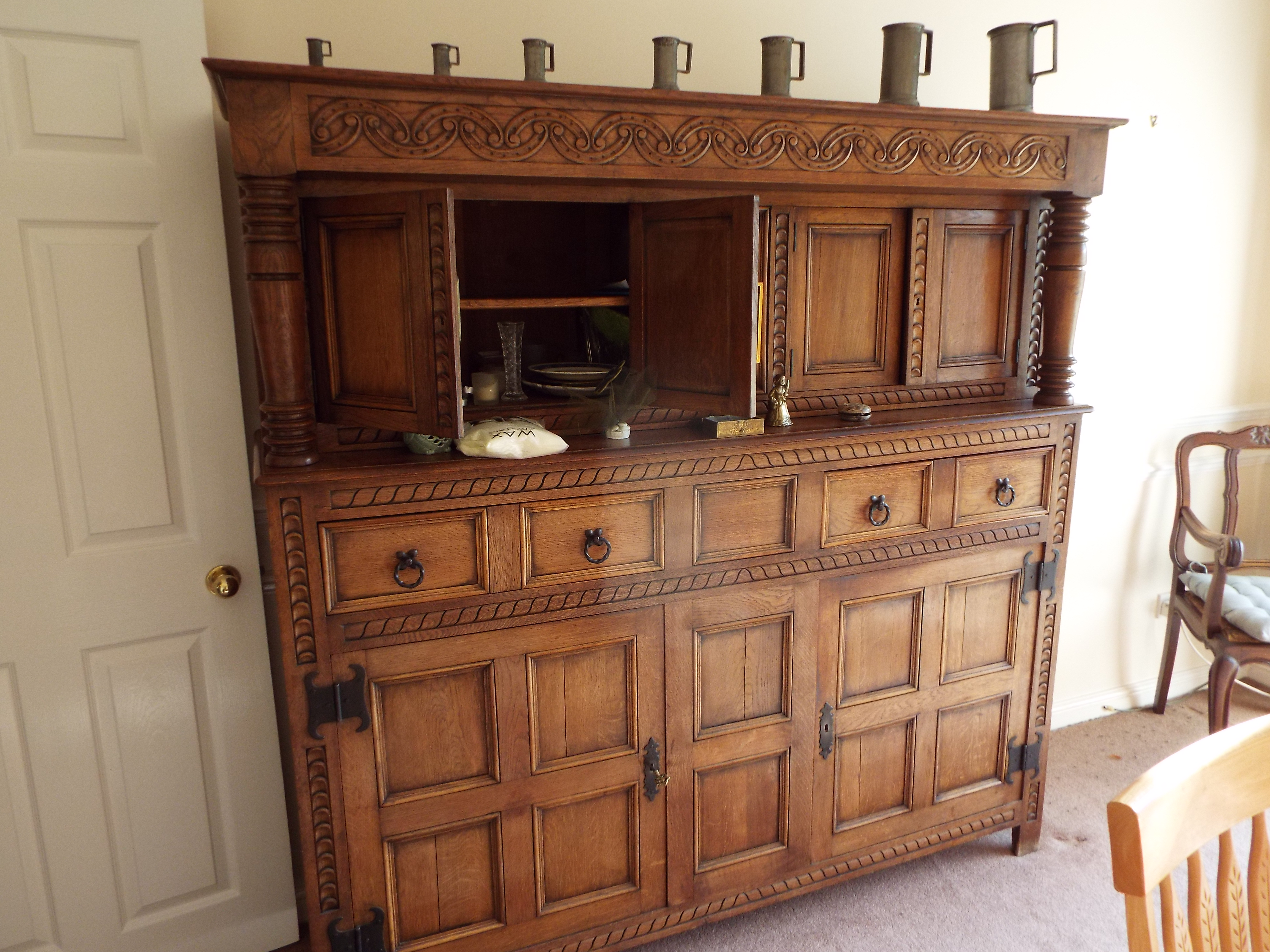An oak court cupboard with carved decoration having an arrangement of cupboards and two drawers, - Image 2 of 2