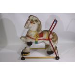 Mobo - A mid century Mobo child's push along tinplate horse.