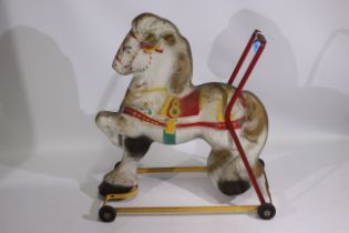 Mobo - A mid century Mobo child's push along tinplate horse.