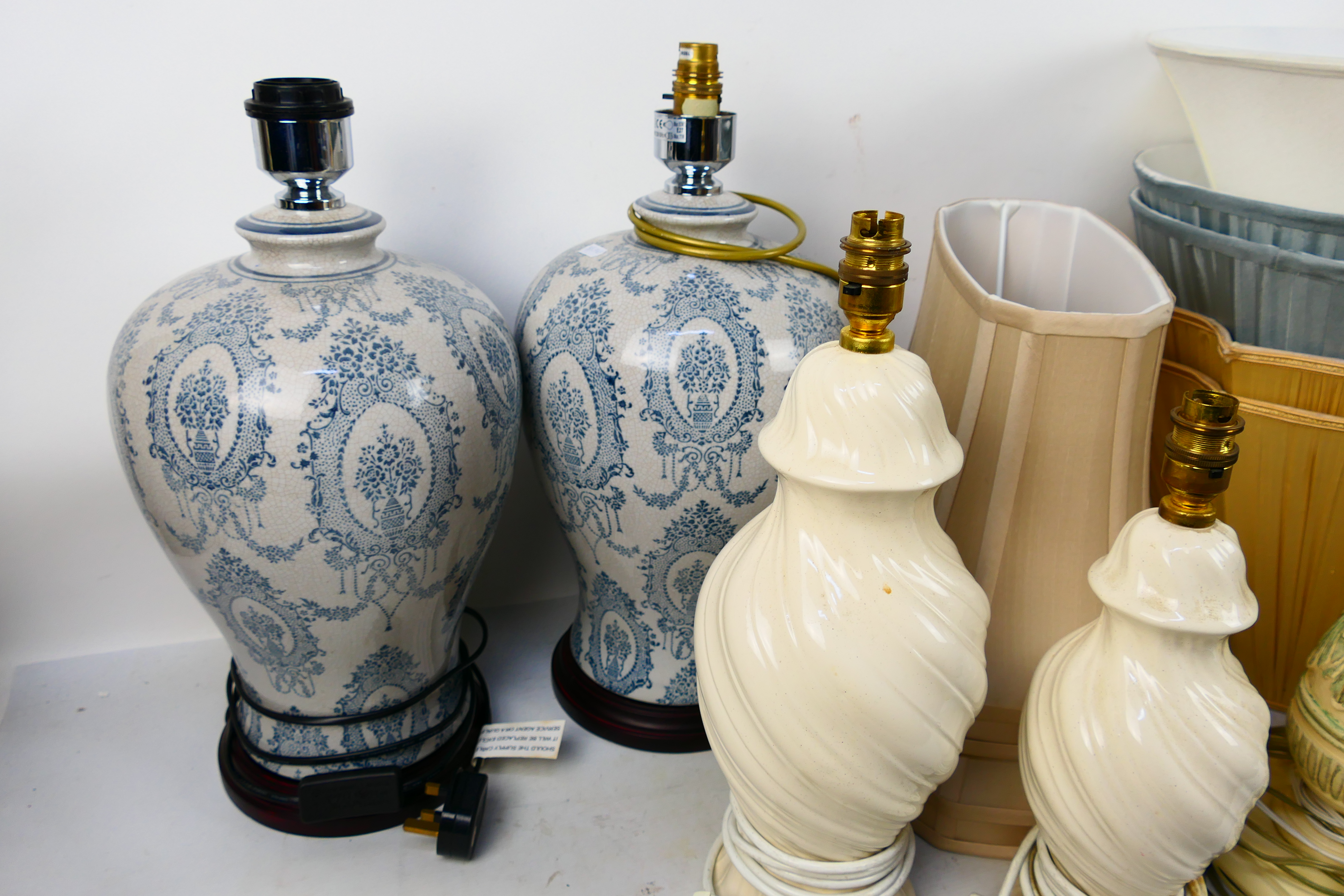 Two pairs of table lamps one pair with blue and white crackle glaze and one further near pair. [2]. - Image 4 of 6