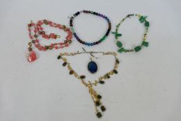 A group of modern semi-precious stone set necklaces including unused examples still with tags and a
