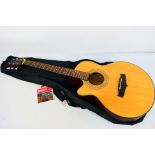 A Tanglewood left handed electro acoustic guitar, model TFC-E-LH NA,