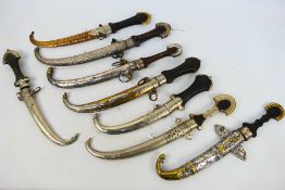A group of 19th century and later Moroccan koummya type daggers with scabbards,