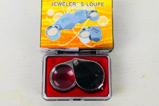 A jeweller's loupe, 30x magnification, new and unused, cased.