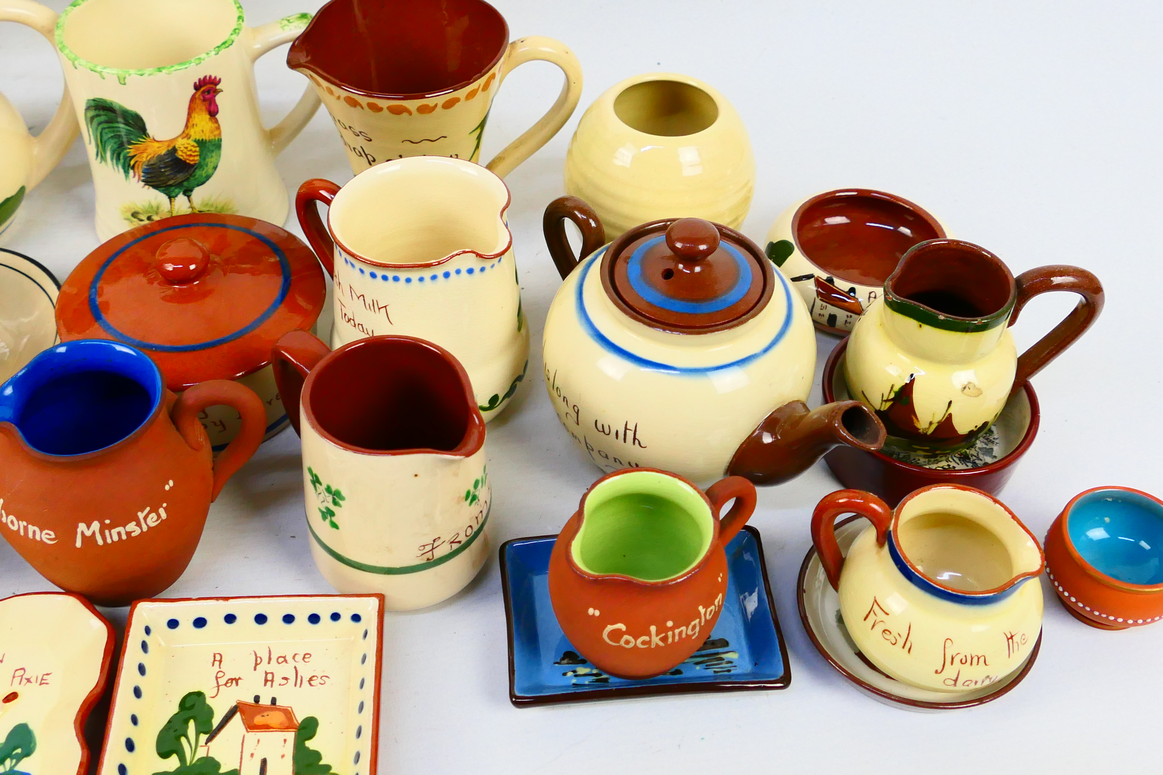 A collection of Torquay pottery wares to include bowls, jugs, vases, - Image 8 of 8