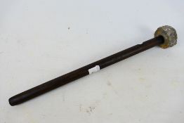A crude trench club, the wooden shaft with lead weighted head, 44 cm (l).