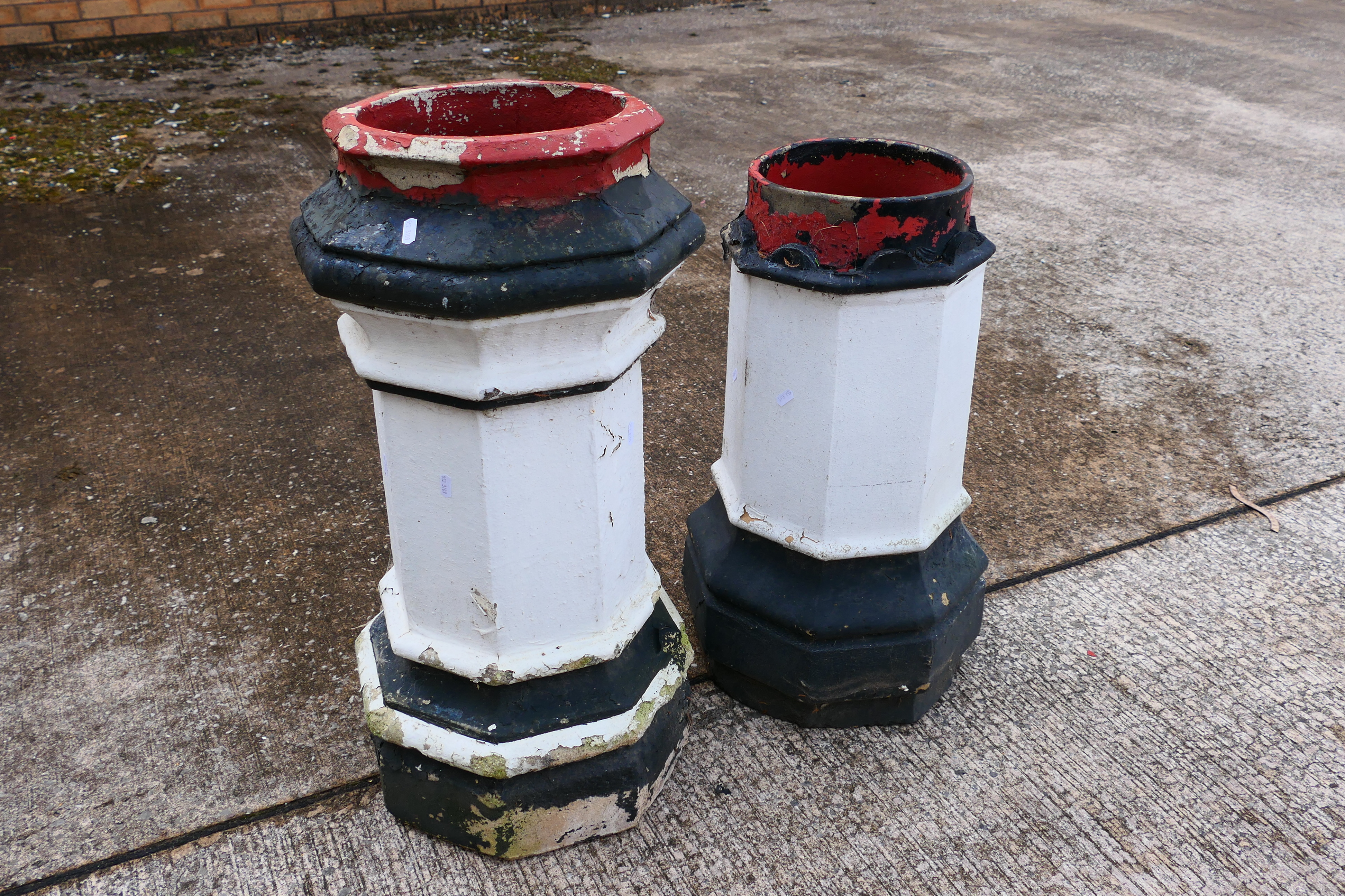 Two vintage, octagonal section chimney pots, largest approximately 75 cm (h). [2].