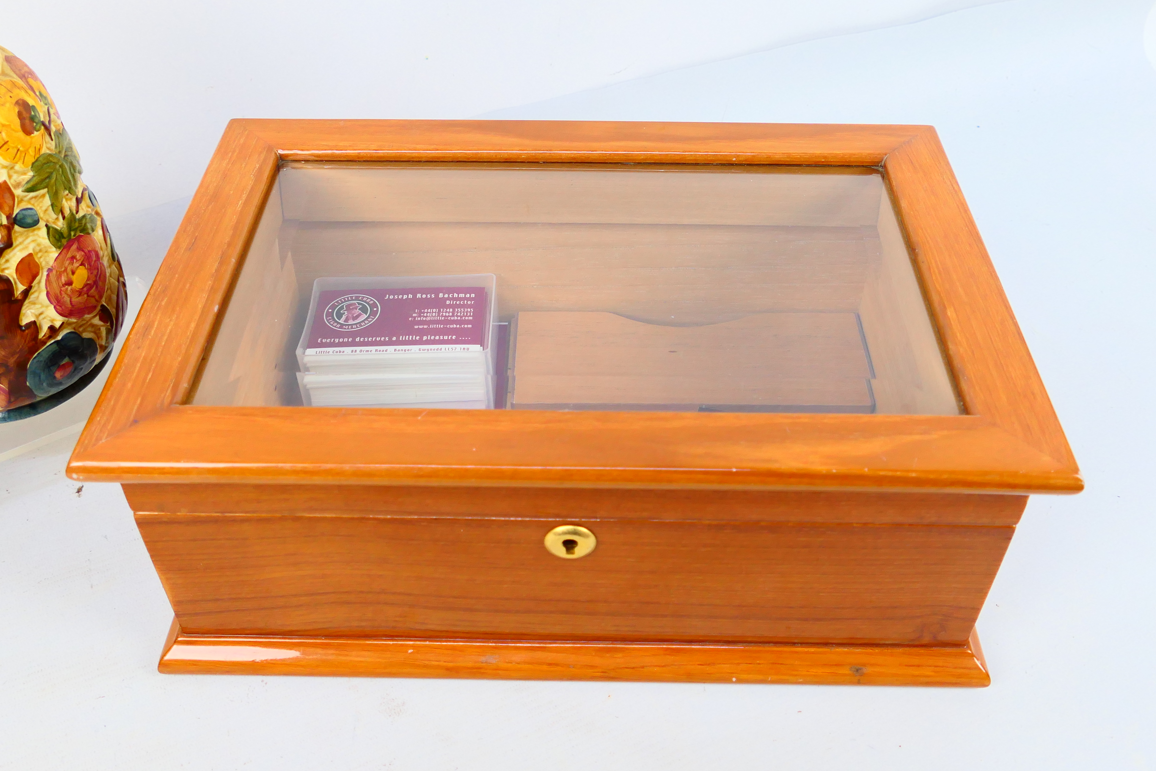 Lot to include a glass top cigar humidor, 14 cm x 36 cm x 24 cm and two H Wood Indian Tree vases. - Image 6 of 6