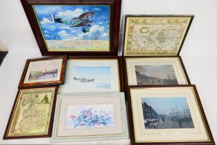 A group of framed prints, various sizes.