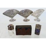 Lot to include three white metal menu holders in the form of fans, a filigree scent bottle holder,