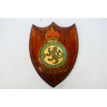A World War Two RAF Squadron plaque, 157 Squadron, hand painted metal badge on wooden shield plaque,