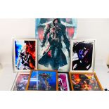 A collection of framed pictures to include Manga, Star Wars,