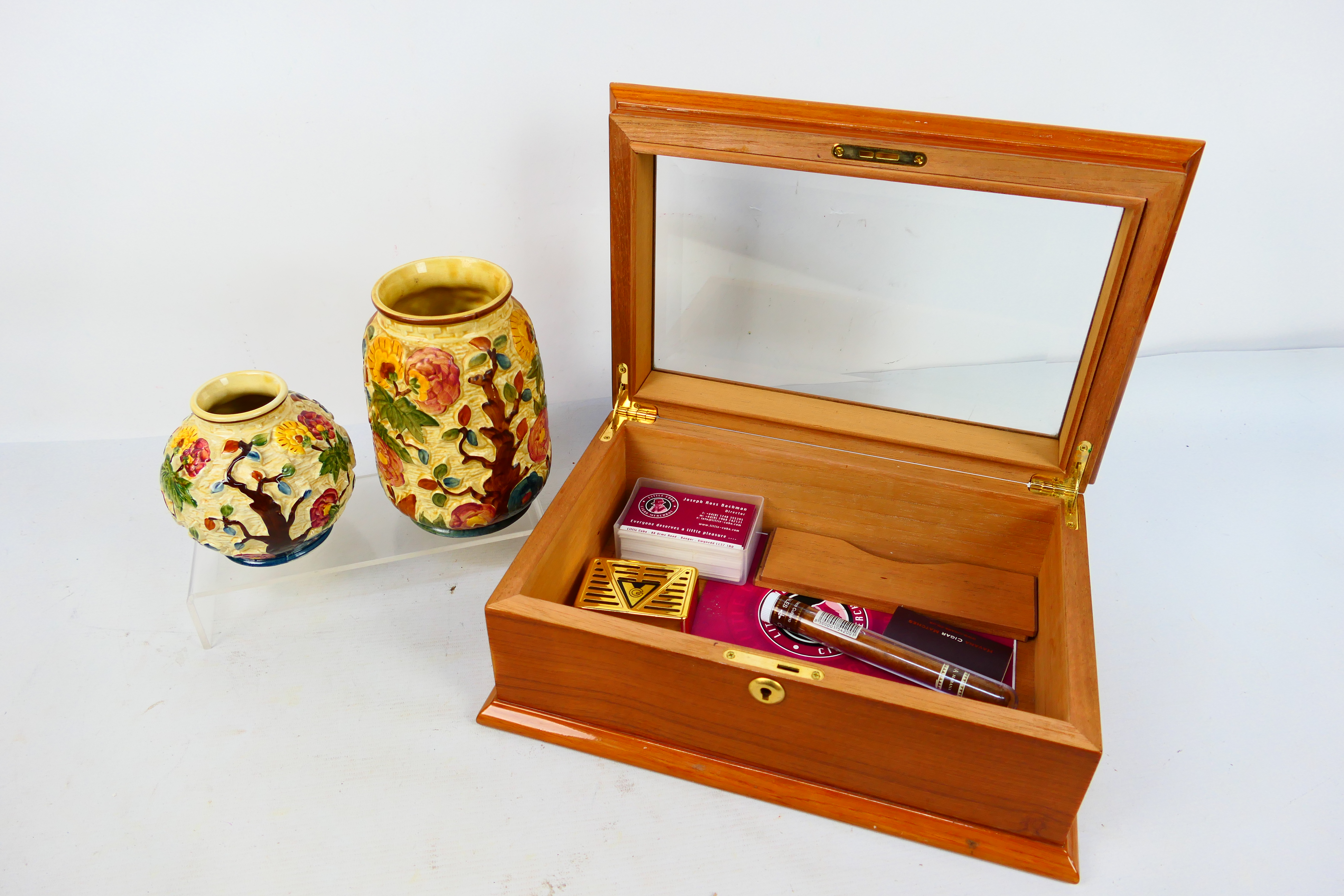 Lot to include a glass top cigar humidor, 14 cm x 36 cm x 24 cm and two H Wood Indian Tree vases.