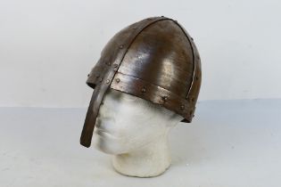 A reproduction Viking Spangenhelm type helmet with nasal bar, 21 cm (d).