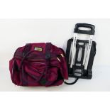 Bowling Accessories - A Drakes Pride fold flat trolley and bowls bag.
