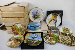 A quantity of collector plates to include African wildlife, aviation and other, part boxed.