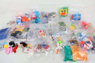 McDonalds - A large collection of plastic McDonalds toys.