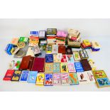 A varied collection of vintage playing cards, approximately 90 packs.