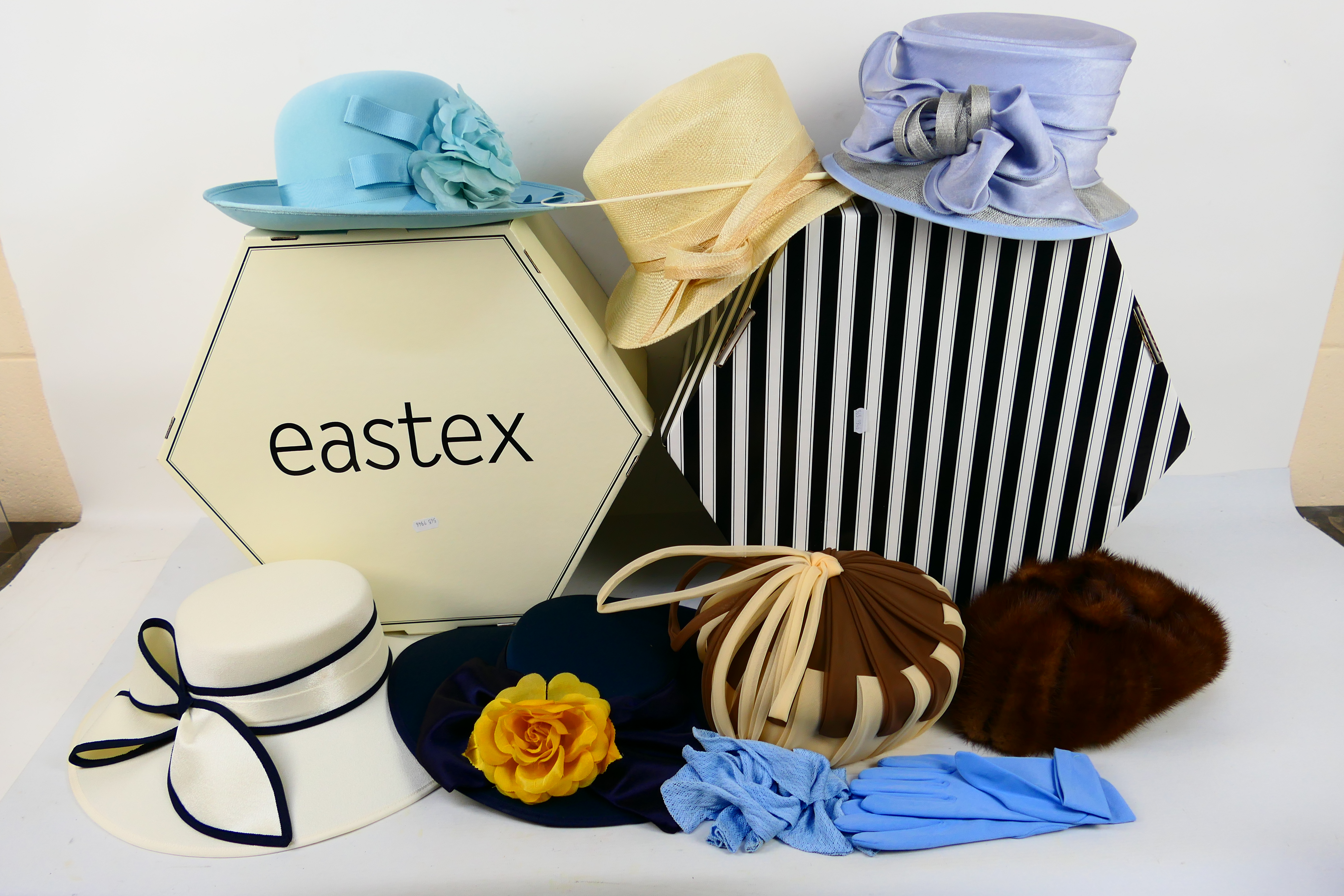 Two hat boxes containing a quantity of lady's hats. [2].