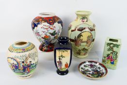 A collection of Oriental ceramics comprising vases and a shallow bowl,