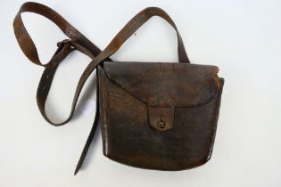 A World War One (WW1 / WWI) leather pouch and strap.