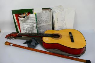 A Kent acoustic guitar contained in case